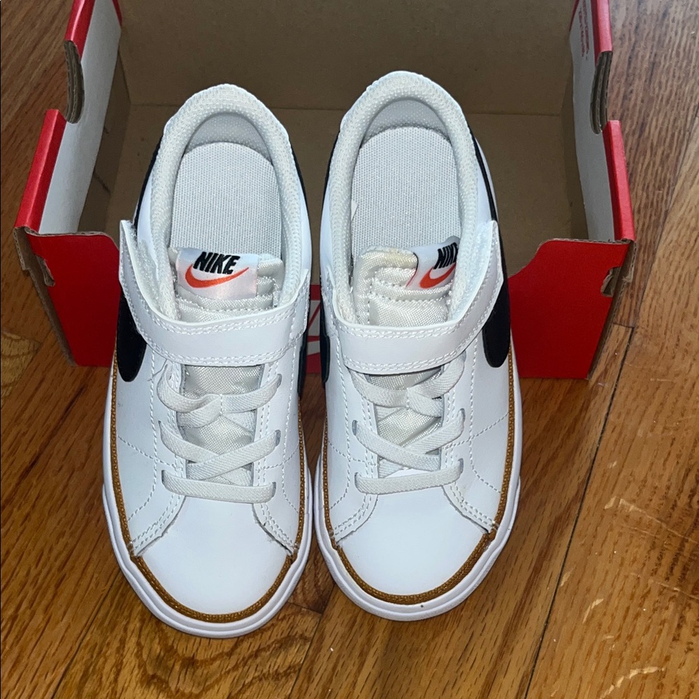 Nike sneakers, black & white with tan trimming. 10C Brand new, never worn.